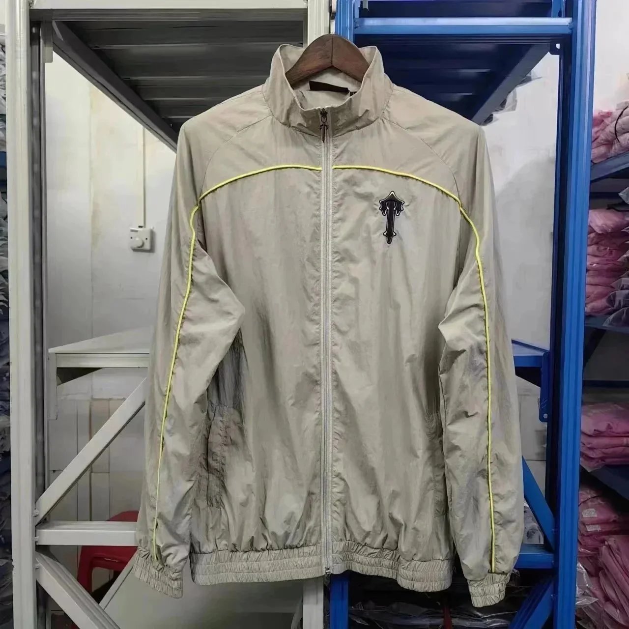A windbreaker set with embroidered letters and a zipper