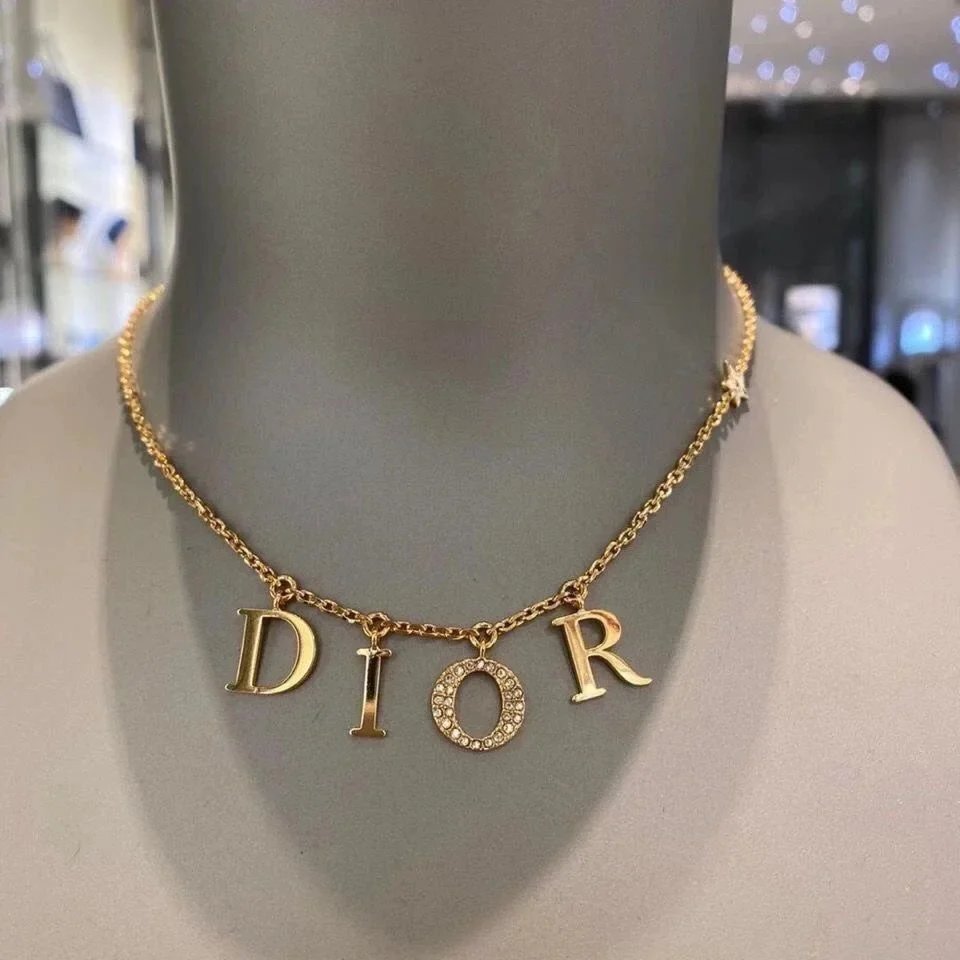 A versatile letter pendant necklace set with diamonds